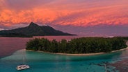 Dramatic Tahiti sunset with Catamaran