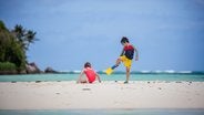 Kids playing on Seychelles beach